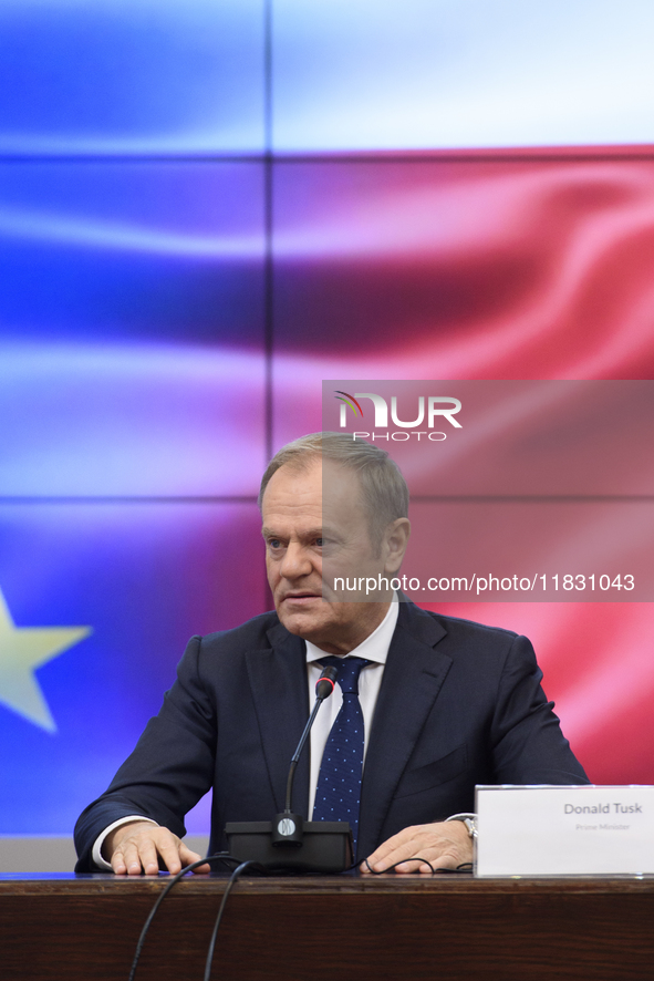 Polish Prime Minister Donald Tusk gestures as he speaks during a meeting with the Secretary-General of the Council of the European Union (EU...