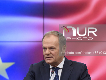 Polish Prime Minister Donald Tusk gestures as he speaks during a meeting with the Secretary-General of the Council of the European Union (EU...