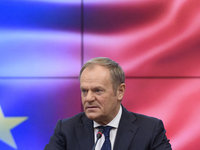 Polish Prime Minister Donald Tusk gestures as he speaks during a meeting with the Secretary-General of the Council of the European Union (EU...