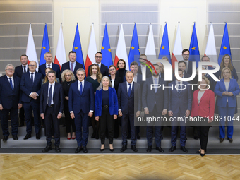 Polish Prime Minister Donald Tusk and the Polish Ministerial Cabinet pose for a family photo with Secretary-General of the Council of the Eu...