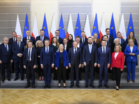 Polish Prime Minister Donald Tusk and the Polish Ministerial Cabinet pose for a family photo with Secretary-General of the Council of the Eu...