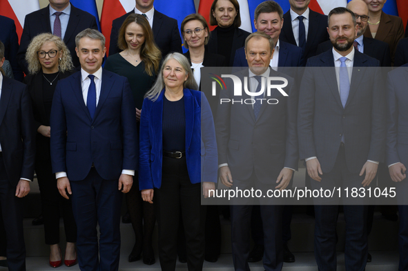 Polish Prime Minister Donald Tusk and the Polish Ministerial Cabinet pose for a family photo with Secretary-General of the Council of the Eu...