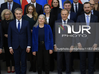 Polish Prime Minister Donald Tusk and the Polish Ministerial Cabinet pose for a family photo with Secretary-General of the Council of the Eu...