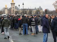 Taxi drivers gather at the Invalides during a protest against lower mileage rates for medical patient transport in Paris, France, on Decembe...