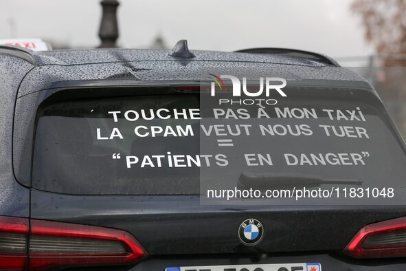 Taxi drivers gather at the Invalides in Paris, France, on December 3, 2024, during a demonstration against a new downward pricing system for...