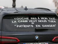 Taxi drivers gather at the Invalides in Paris, France, on December 3, 2024, during a demonstration against a new downward pricing system for...