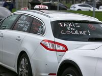 Taxi drivers gather at the Invalides in Paris, France, on December 3, 2024, during a demonstration against a new downward pricing system for...