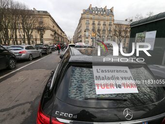 Taxi drivers gather at the Invalides, in front of the Assemblee nationale, during a protest against lower mileage rates for medical patient...