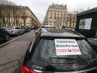 Taxi drivers gather at the Invalides, in front of the Assemblee nationale, during a protest against lower mileage rates for medical patient...