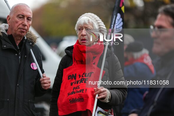 Retirees participate in a rally to call for pensions to be raised with inflation in Paris, France, on December 3, 2024, near the Prime Minis...