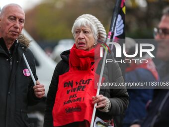 Retirees participate in a rally to call for pensions to be raised with inflation in Paris, France, on December 3, 2024, near the Prime Minis...