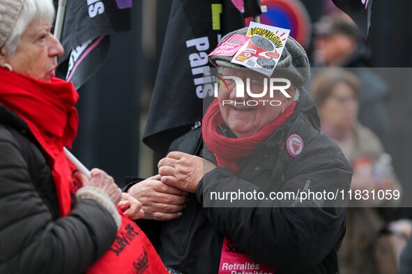 Retirees participate in a rally to call for pensions to be raised with inflation in Paris, France, on December 3, 2024, near the Prime Minis...