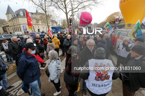 Retirees participate in a rally to call for pensions to be raised with inflation in Paris, France, on December 3, 2024, near the Prime Minis...