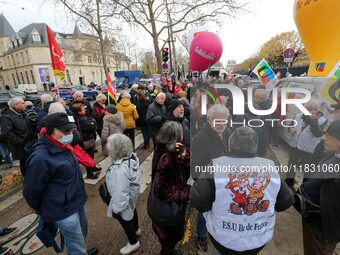 Retirees participate in a rally to call for pensions to be raised with inflation in Paris, France, on December 3, 2024, near the Prime Minis...