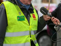 A retiree speaks with the press during a rally by retired people to call for pensions to be raised with inflation in Paris, France, on Decem...