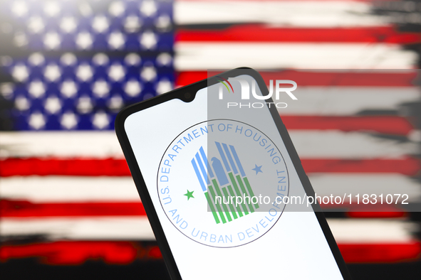 The United States Department of Housing and Urban Development (HUD) logo appears on the screen of a smartphone, and in the background, the f...