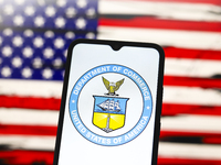 The United States Department of Commerce (DOC) logo appears on the screen of a smartphone, and in the background, the flag of the United Sta...