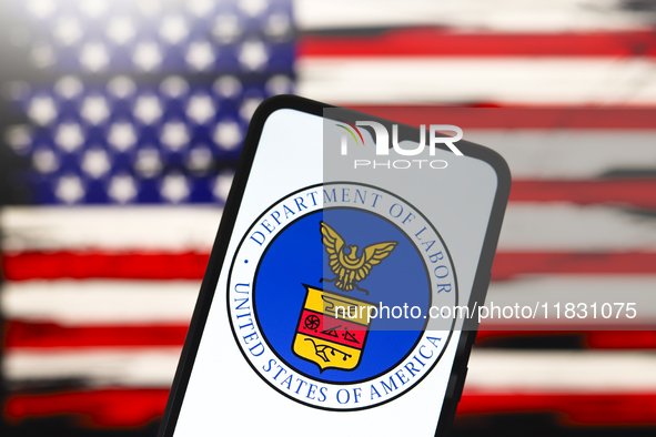 The United States Department of Labor (DOL) logo appears on the screen of a smartphone, and in the background, the flag of the United States...