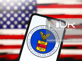 The United States Department of Labor (DOL) logo appears on the screen of a smartphone, and in the background, the flag of the United States...