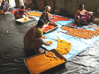 Workers prepare ''Laddu,'' a ball-shaped sweet, inside a workshop for sale in the wholesale market in Jayanagar village on the outskirts of...