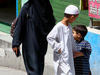 A Muslim woman and her two children walk along a street in Mussoorie, Uttarakhand, India, on April 18, 2024. (