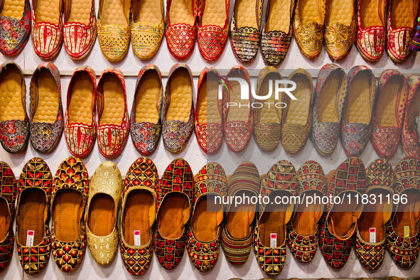 Traditional shoes are displayed at a small shop in Mussoorie, Uttarakhand, India, on April 18, 2024. 