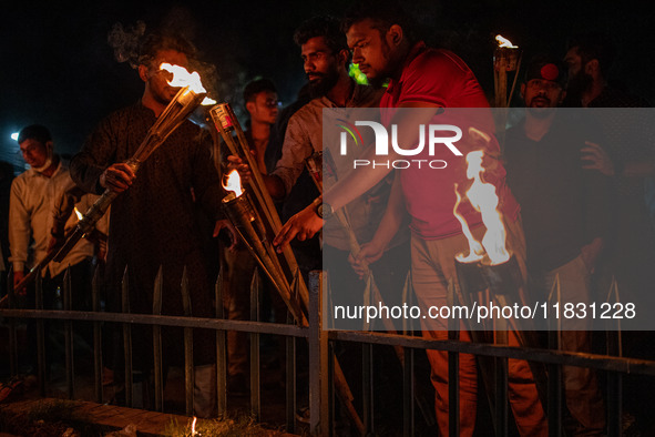 Bangladeshi activists stage a protest rally and torch procession against the attack on the Bangladesh Assistant High Commission in Agartala...