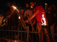 Bangladeshi activists stage a protest rally and torch procession against the attack on the Bangladesh Assistant High Commission in Agartala...