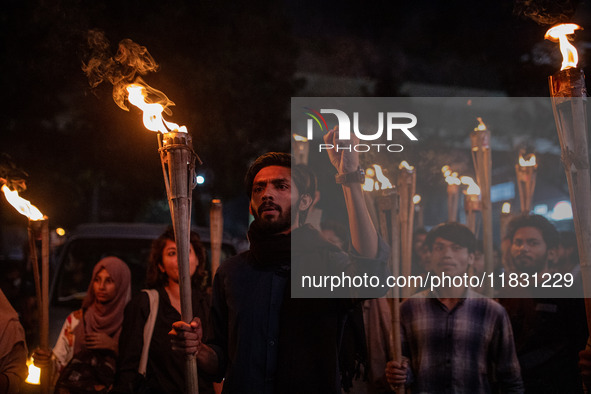 Bangladeshi activists of the Democratic Students Alliance stage a protest rally and torch procession against the attack on the Bangladesh As...