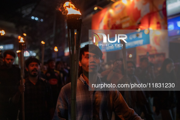 Bangladeshi activists of the Democratic Students Alliance stage a protest rally and torch procession against the attack on the Bangladesh As...