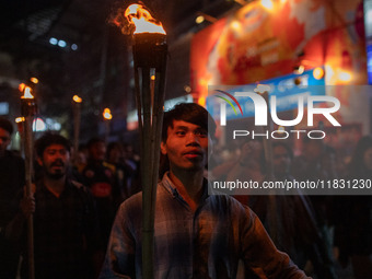 Bangladeshi activists of the Democratic Students Alliance stage a protest rally and torch procession against the attack on the Bangladesh As...