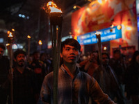 Bangladeshi activists of the Democratic Students Alliance stage a protest rally and torch procession against the attack on the Bangladesh As...