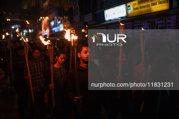 Bangladeshi activists of the Democratic Students Alliance stage a protest rally and torch procession against the attack on the Bangladesh As...