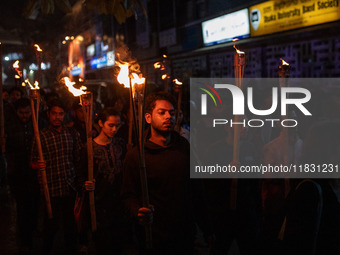 Bangladeshi activists of the Democratic Students Alliance stage a protest rally and torch procession against the attack on the Bangladesh As...