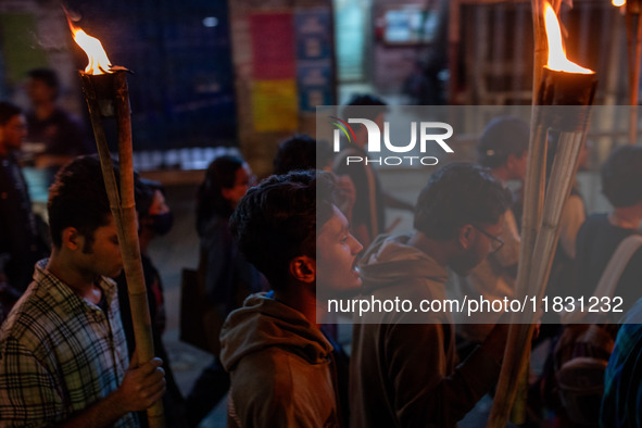 Bangladeshi activists of the Democratic Students Alliance stage a protest rally and torch procession against the attack on the Bangladesh As...