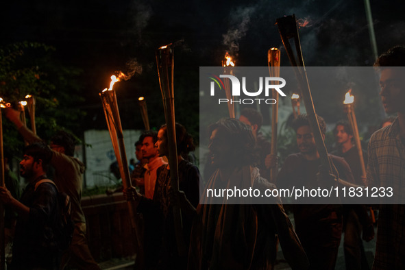 Bangladeshi activists of the Democratic Students Alliance stage a protest rally and torch procession against the attack on the Bangladesh As...