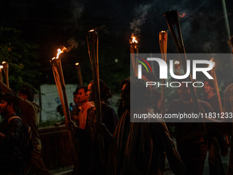 Bangladeshi activists of the Democratic Students Alliance stage a protest rally and torch procession against the attack on the Bangladesh As...