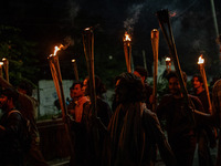 Bangladeshi activists of the Democratic Students Alliance stage a protest rally and torch procession against the attack on the Bangladesh As...