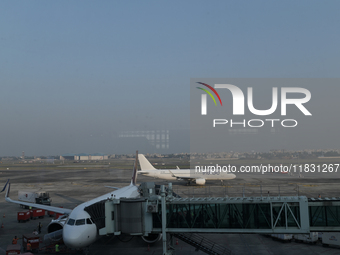 An IndiGo Airlines aircraft taxis on the tarmac at the Netaji Subhash Chandra Bose International Airport in Kolkata, India, on December 3, 2...