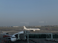 An IndiGo Airlines aircraft taxis on the tarmac at the Netaji Subhash Chandra Bose International Airport in Kolkata, India, on December 3, 2...