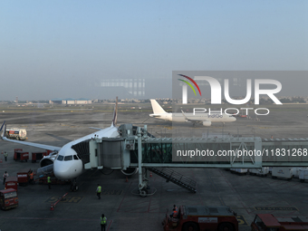 An IndiGo Airlines aircraft taxis on the tarmac at the Netaji Subhash Chandra Bose International Airport in Kolkata, India, on December 3, 2...