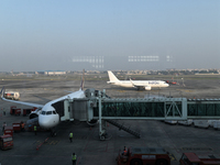 An IndiGo Airlines aircraft taxis on the tarmac at the Netaji Subhash Chandra Bose International Airport in Kolkata, India, on December 3, 2...