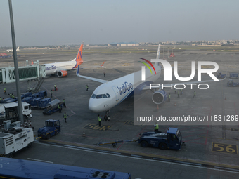 An IndiGo Airlines aircraft taxis on the tarmac at the Netaji Subhash Chandra Bose International Airport in Kolkata, India, on December 3, 2...