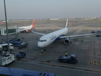 An IndiGo Airlines aircraft taxis on the tarmac at the Netaji Subhash Chandra Bose International Airport in Kolkata, India, on December 3, 2...