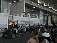 Passengers wait for their flights at the Netaji Subhash Chandra Bose International Airport in Kolkata, India, on December 3, 2024. (