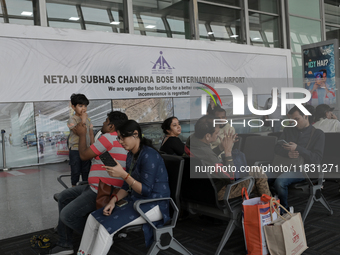 Passengers wait for their flights at the Netaji Subhash Chandra Bose International Airport in Kolkata, India, on December 3, 2024. (