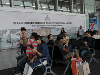 Passengers wait for their flights at the Netaji Subhash Chandra Bose International Airport in Kolkata, India, on December 3, 2024. (