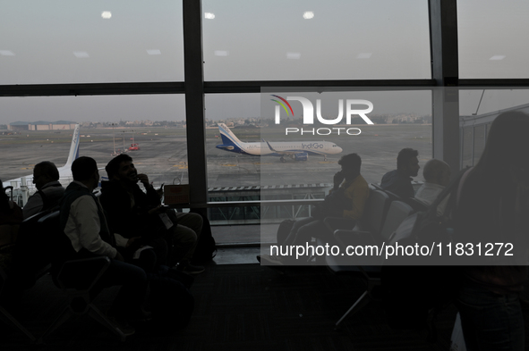 Passengers wait for their flights at the Netaji Subhash Chandra Bose International Airport in Kolkata, India, on December 3, 2024. 