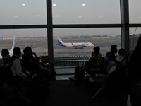 Passengers wait for their flights at the Netaji Subhash Chandra Bose International Airport in Kolkata, India, on December 3, 2024. (