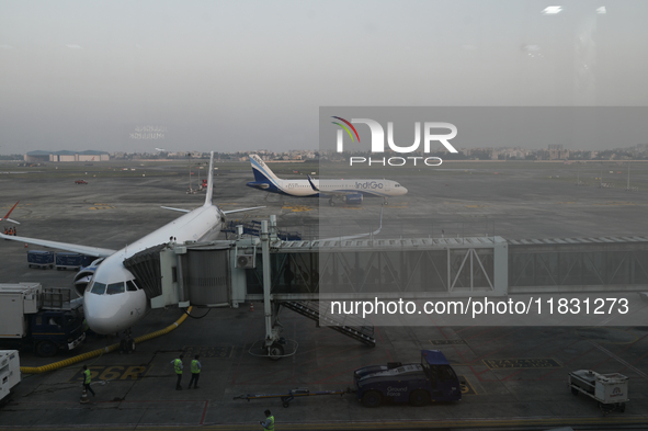 An IndiGo Airlines aircraft taxis on the tarmac at the Netaji Subhash Chandra Bose International Airport in Kolkata, India, on December 3, 2...